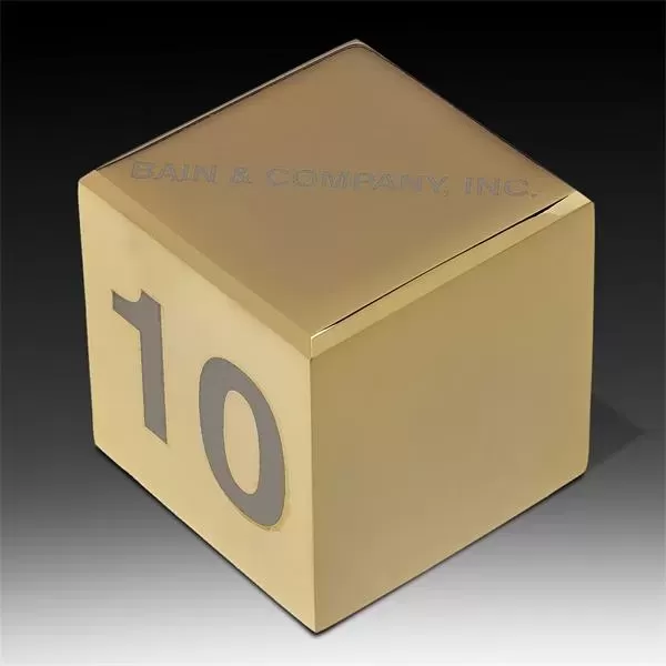 Cube shaped brass paperweight