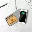 Wirelessly charges compatible smartphones.